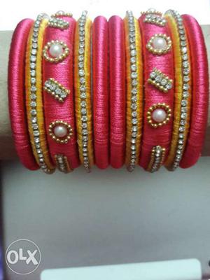 Pink and yellow thread bangles