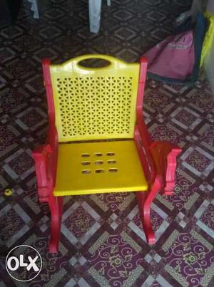 Red And Yellow Plastic Rocking Armchair