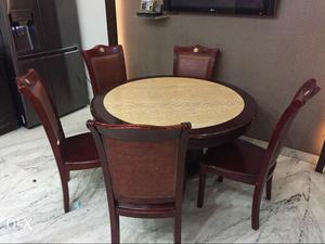 Round Black And Beige Wooden Table With Five Chair Dining