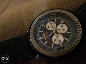 Round Black And Brown Chronograph Watch With Black Strap