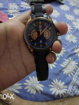 Round Black And Gold Chronograph Watch With Rubber Strap