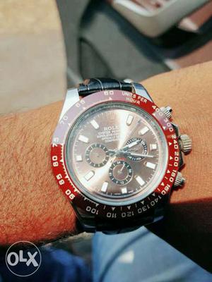 Round Red Rolex Chronograph Watch