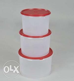 Three White And Red Plastic Containers