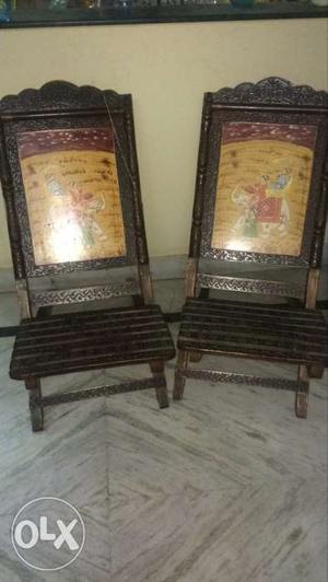 Two Brown Wooden Chairs