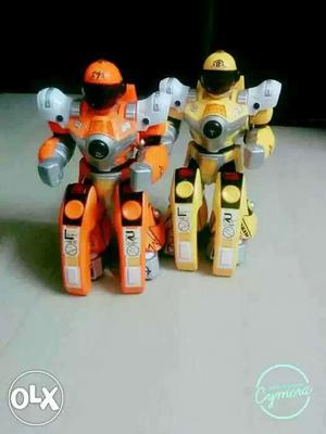Two Yellow And Orange Toy Action Figures