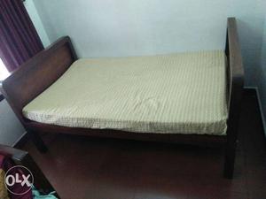 An old rosewood single cot