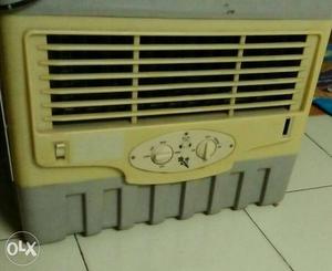 Beige And Gray Window-type Air Conditioner Unit