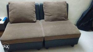 Black And Brown Padded Armless Sofa