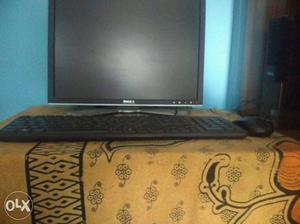 Black Dell Computer Monitor With Keyboard And Mouse