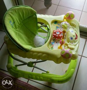 Fab & Funky baby walker in cool green color.
