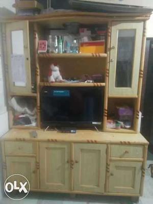 Flat Screen TV With Brown Wooden Entertainment Hutch