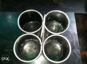 Four Gray Steel Buckets