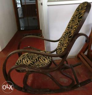 Rocking chair wood with cushioned seats, used.