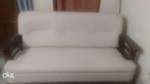 Sofa with wooden platform in a good condition