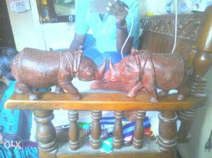 Two Brown Rhino Figurines