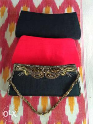 3 raw silk clutch purses - black, red, black with