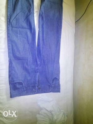 A product of denim quality with size of 36 waist