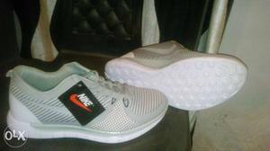 New white and grey Nike shoe