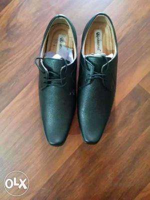 Pair Of Black Leather Derby Shoes