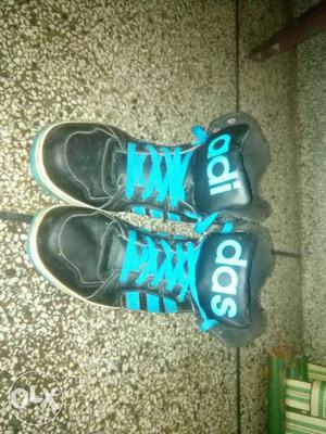 Pair Of Blue-and-black Adidas Shoes one pair of bladed shoes