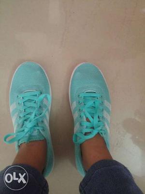 Pair Of Teal-and-white Adidas Running Shoes