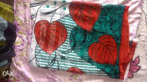 Red,green And White Floral Textile
