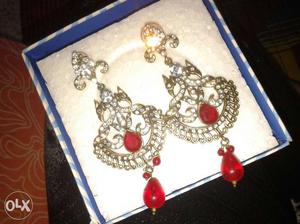 Two Gold Embellished With Red Gemstone Earrings In Box