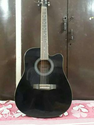 Acostic jumbo guitar.. Black colour. 4months old