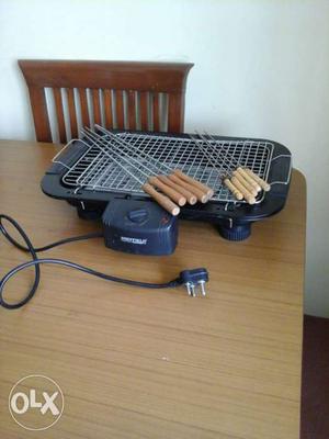 Electric grill with skewers... selectively used