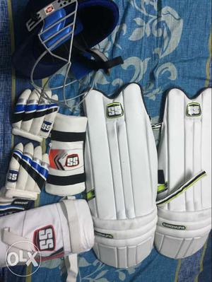 Pair Of White Cricket Pads, Gloves And Helmet