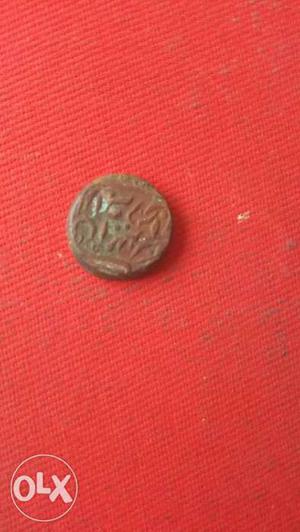 Round Brown Ancient Coin