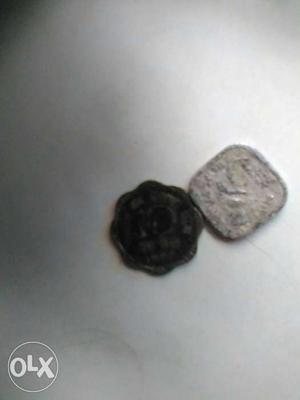 Two Black And Silver Coins