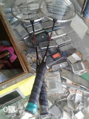 Two Grey Cosco Badminton Rackets