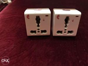 Two White Electric Sockets