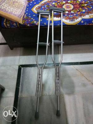 Walking stick crutches under arms new pair