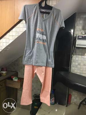 Gray V-neck Shirt; Orange Pants