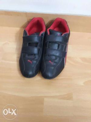 Pair Of Black-and-red Puma Sneakers