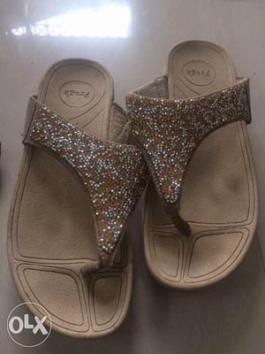 Pair Of White And Gold Slippers