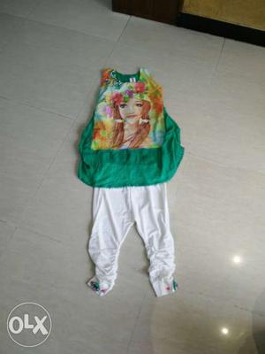 Toddlers Green Sleeveless Shirt And White Pants