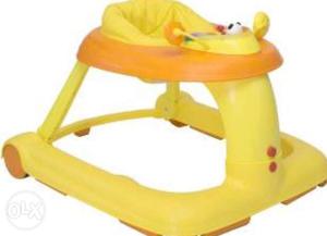 Toddler's Yellow And Orange Chicco walker with music