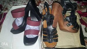 Two pair of maroon and black chunky heels brand