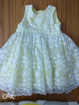 Yellow flower dress for girl upto 2 years of age