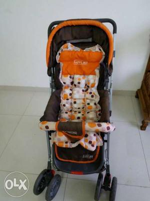 Baby's Black White And Orange Convertible Stroller