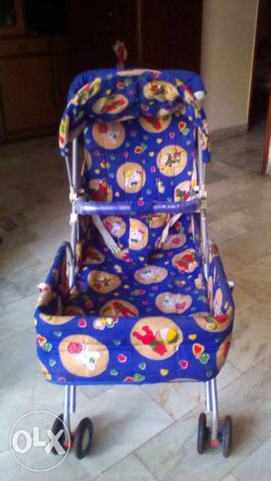 Baby's Blue And Red Stroller