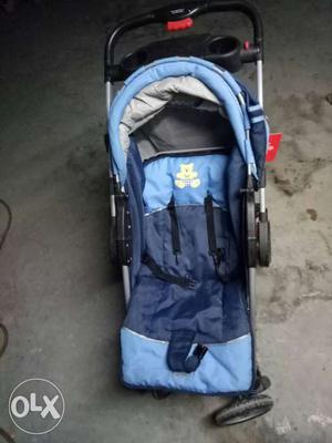 Baby's Blue And White Stroller