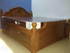 Brown Wooden Bed With White Mattress