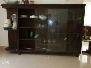 Brown Wooden Counter With Display Cabinet