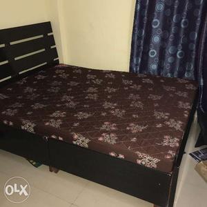 Queen size double bed with storage and mattress. 2 year old