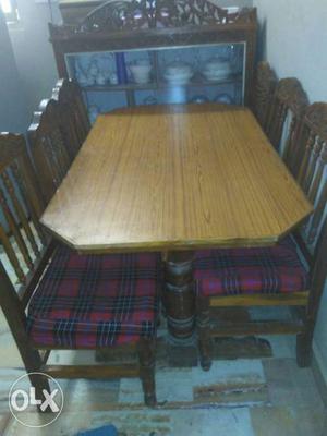 Rectangular Brown Wooden Table With Six Chairs