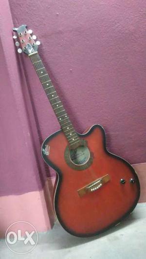 Red And Black Cut Away Acoustic Guitar